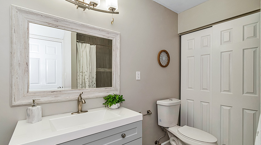 bathroom with sliding doors and white sink monson ma